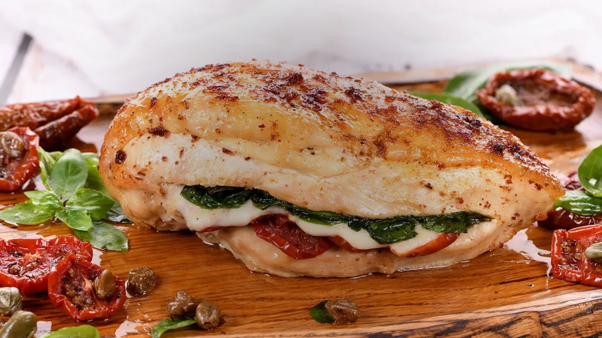 Mozzarella Stuffed Chicken Breast with Spinach and Tomatoes