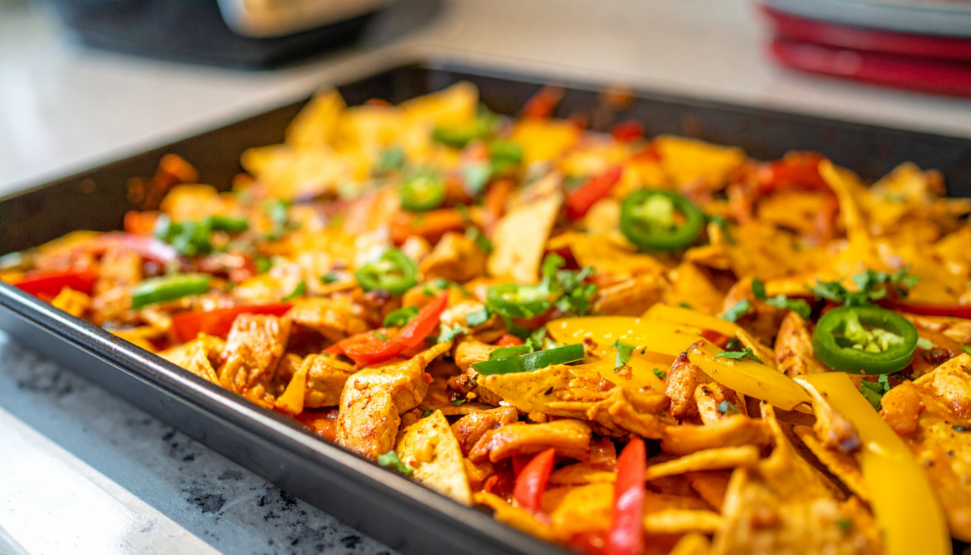 Loaded Sheet-Pan Chicken Fajita Nachos