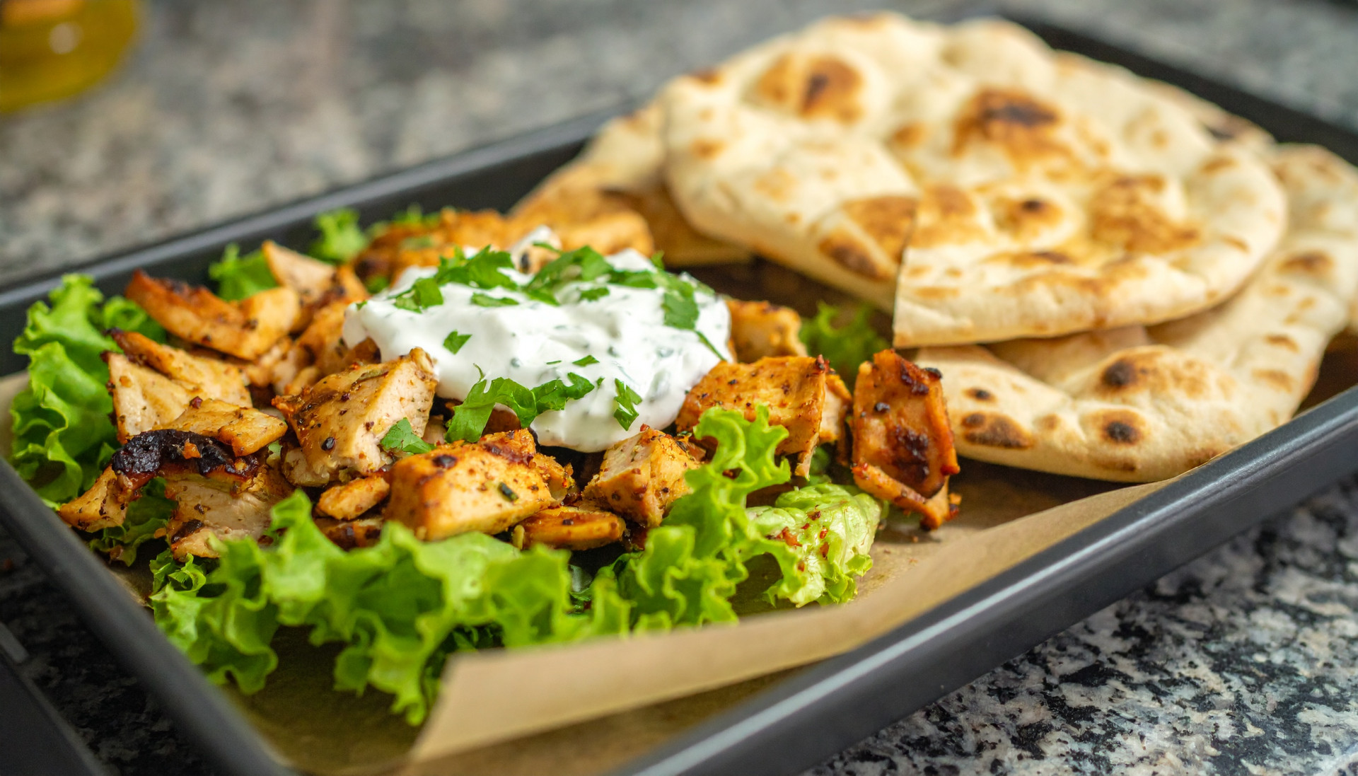 Sheet-Pan Chicken Shawarma with Garlic Yogurt & Warm Pitas