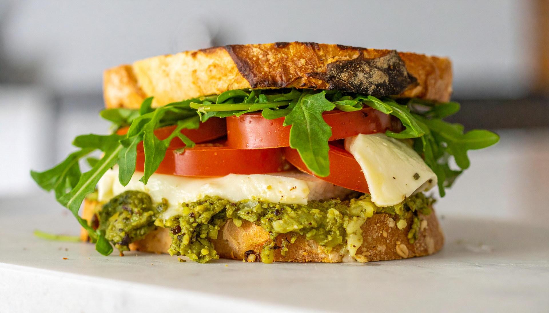 Turkey Pesto Mozzarella Melts with Tomato & Arugula