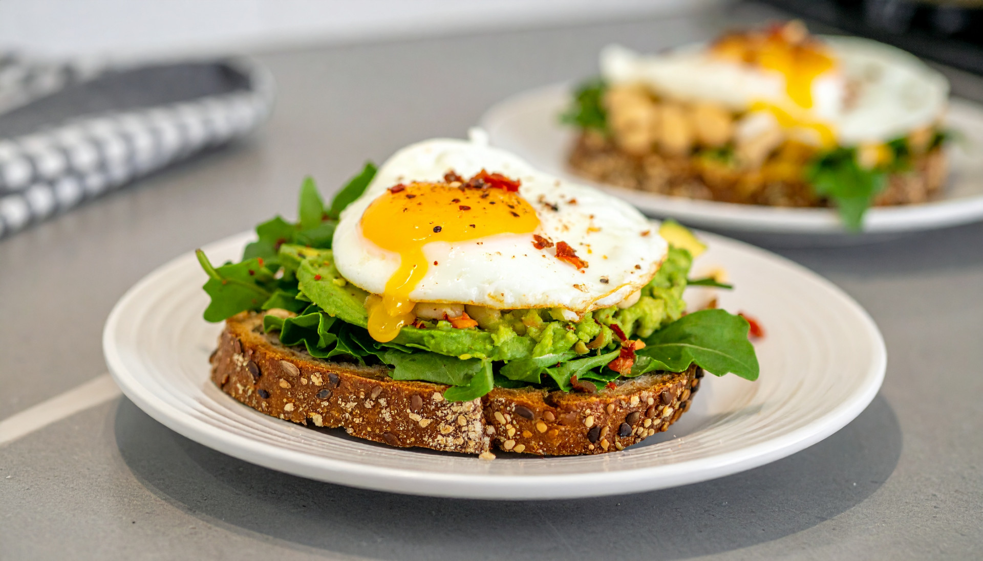 Jammy Egg & Smashed White Bean Toasts with Avocado + Chili Crisp