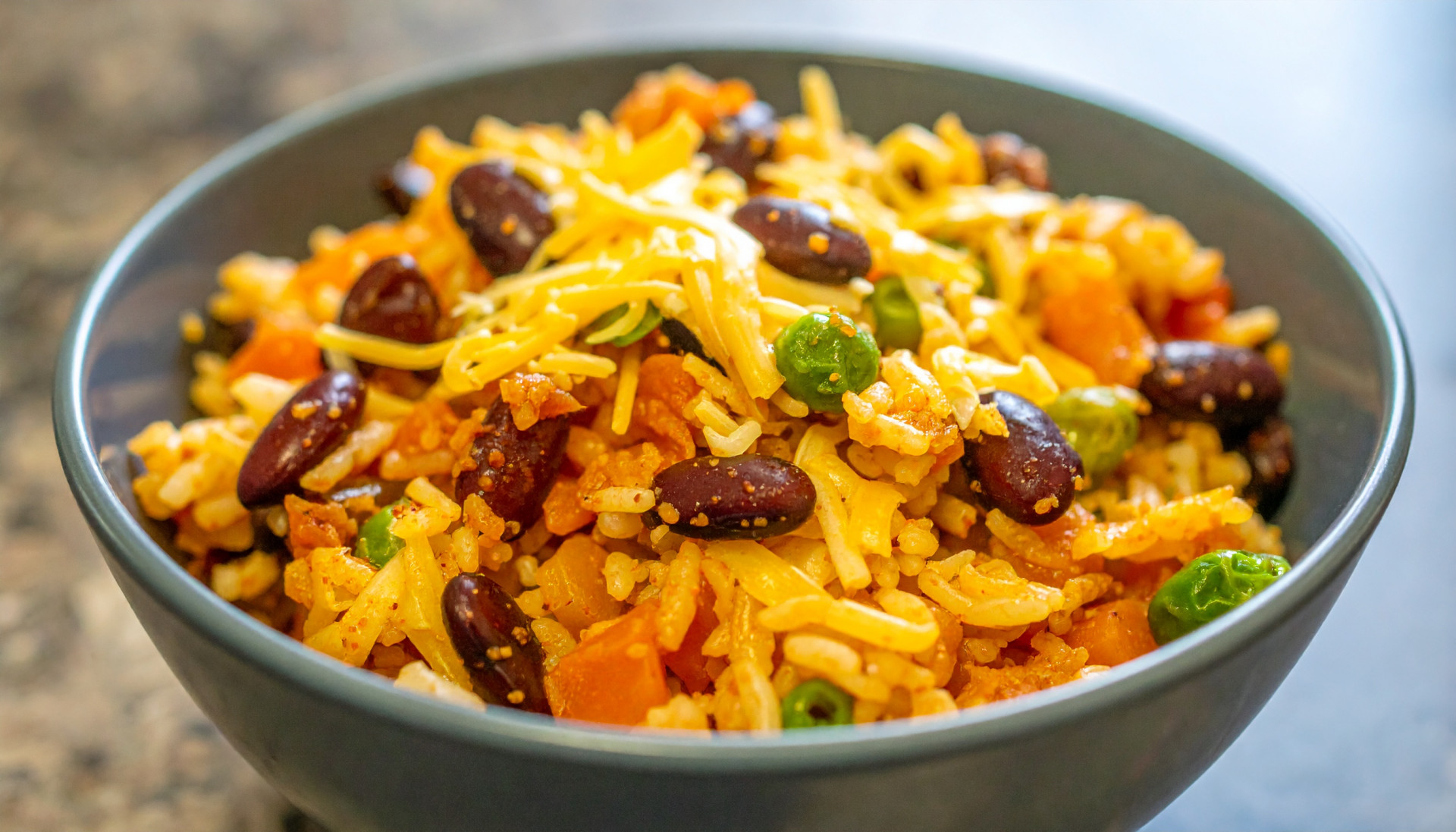 Cheesy bean and rice bowl with mixed veggies