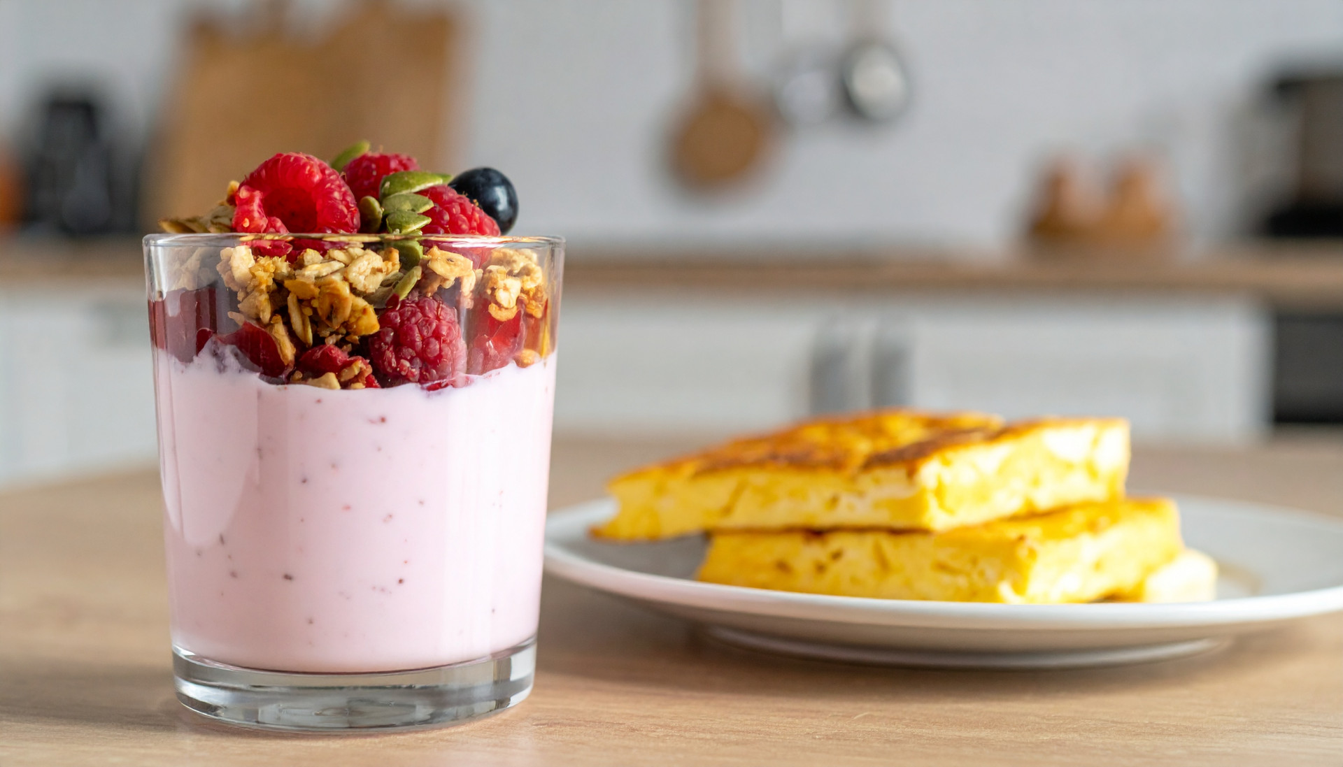 Berry crunch yogurt cup with strawberries, cereal, and pumpkin seeds