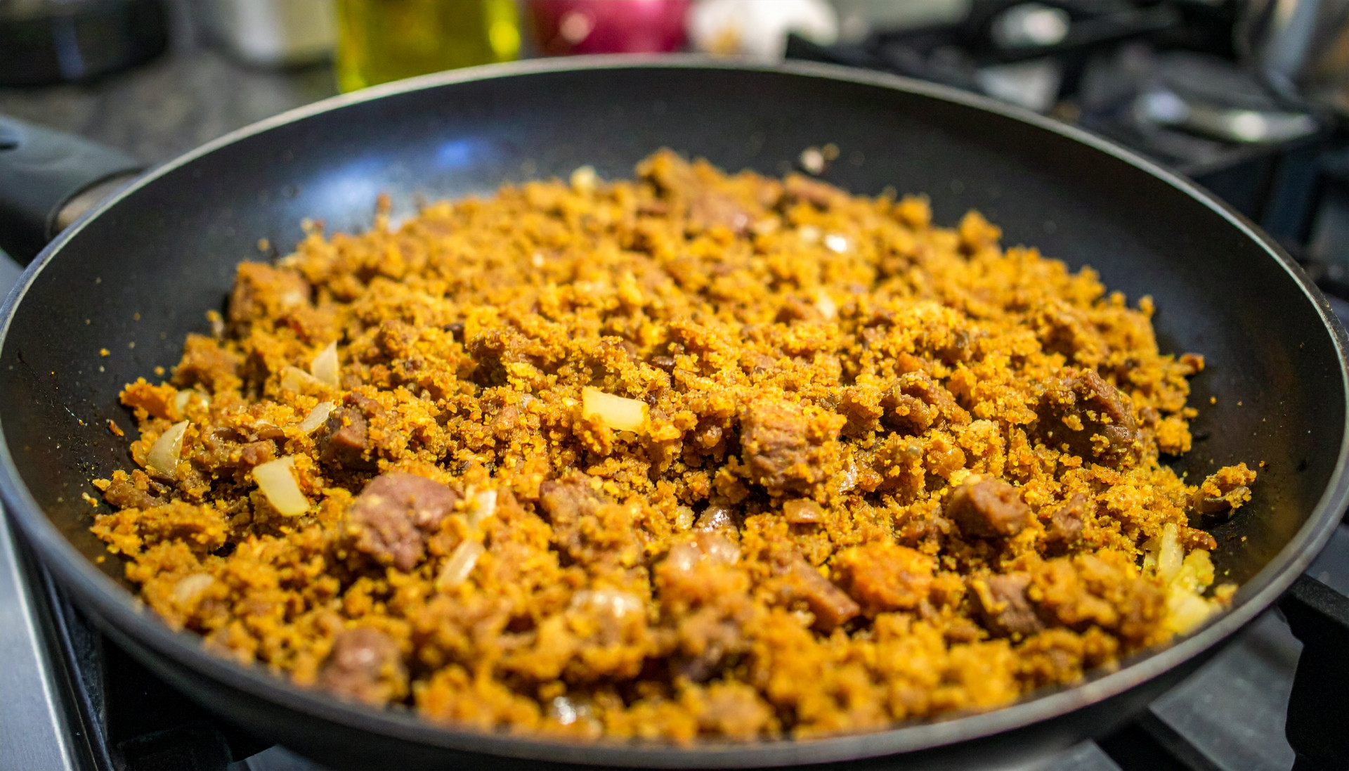 Beef and lentil crumble in a pan on the stovetop
